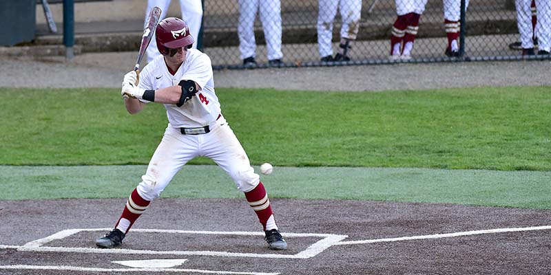 Willamette batter Drew Baskin watches a pitch as it nears the plate.