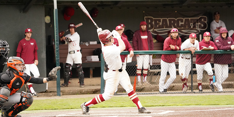 Drew Baskin follows the ball off the bat for the Willamette baseball team.