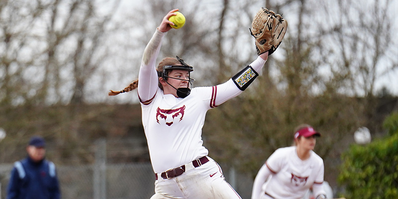 Abigail Loomis winds up to deliver a pitch for the Willamette softball team. 