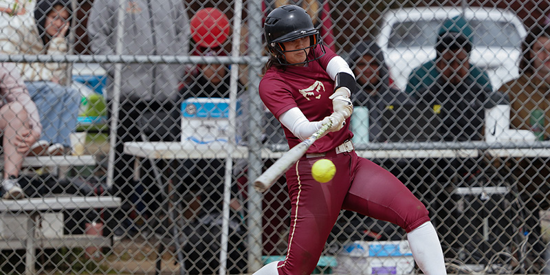 Sophia Lucio is about to make contact with the ball on a swing for the Bearcats.