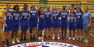 Beyond Sports women's basketball team coached by Peg Swadener, right, in Italy