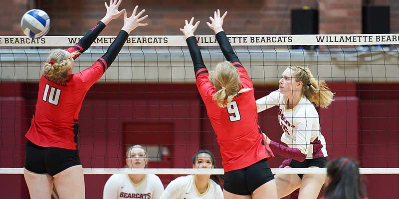 Kaitlyn Westby hit a cross-court attack that eludes two blockers at the net.