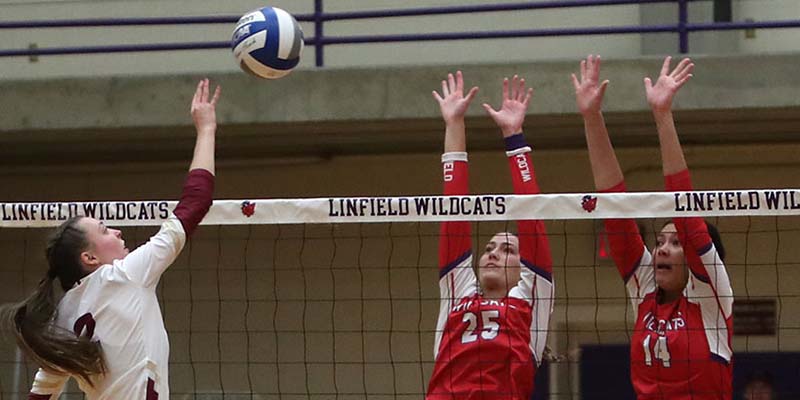 Olivia Cadien (Jr., OH, Mesa, AZ/Chandler Preparatory Academy) dinks the ball over a combo block (Photo courtesy of Linfield Athletics).