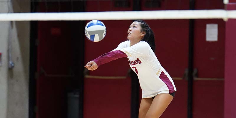 Shyla Sato concentrates while making a dig.