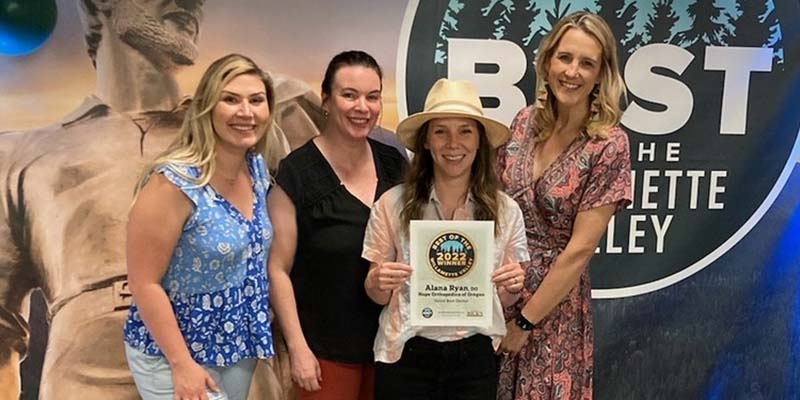 Dr. Alana Ryan, second from right, holding a Best of the Willamette Valley certificate, along with Julia Shields (Exec. Coord. at Hope Orthopedics of Oregon), left, Natalie Kimmel (Marketing Coord. at Hope), second from left, and Lorissa Addabbo (Chief Exec. Officer of Hope), right