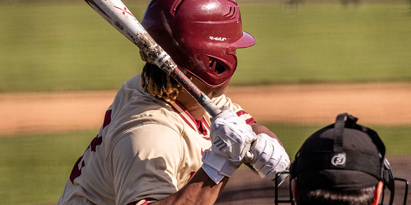 Closeup from behind of Wyatt Thames as he waits at home plate for a pitch. 