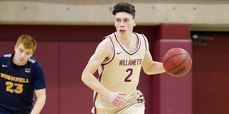 Jack Boydell of Willamette University brings the ball down the court.