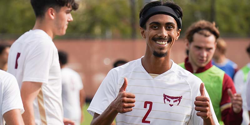 Abdul Ali smiles while showing two thumbs up following a Willamette win.