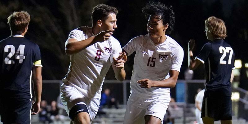 Closeup of Fernando Bitelli, left middle, and Krisna LaFrance, right middle, celebrating a goal