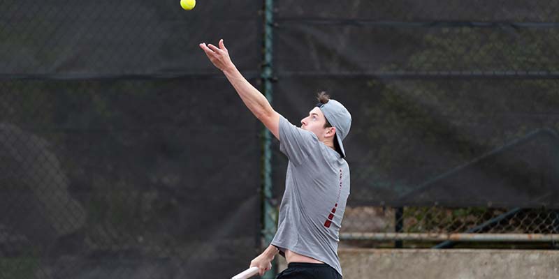 Andrew Kropp tossed the ball to serve.