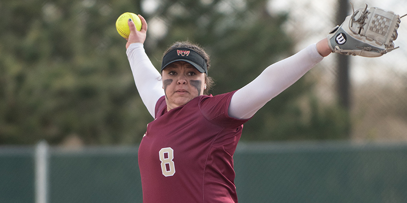 Shaye Mott reaches back before completing a pitch.