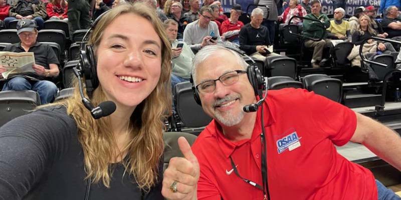 Ava Kitchin, left, and Mike Allegre, right, take a break during the webcast of an OSAA 5A Boys' Basketball State Tournament game.