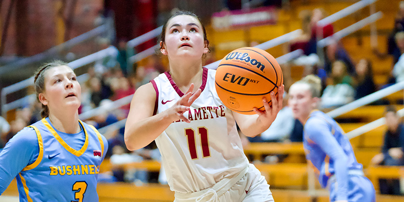 Kaitlin Imai looks up at the basket as she starts to shoot a layup.