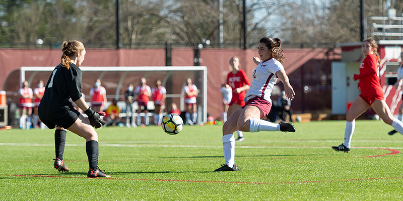 Emma Blackburn shoots as the opposing goal moves forward.