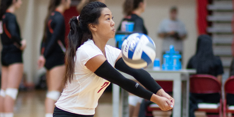 Shyla Sato digs up the ball for the Bearcats.