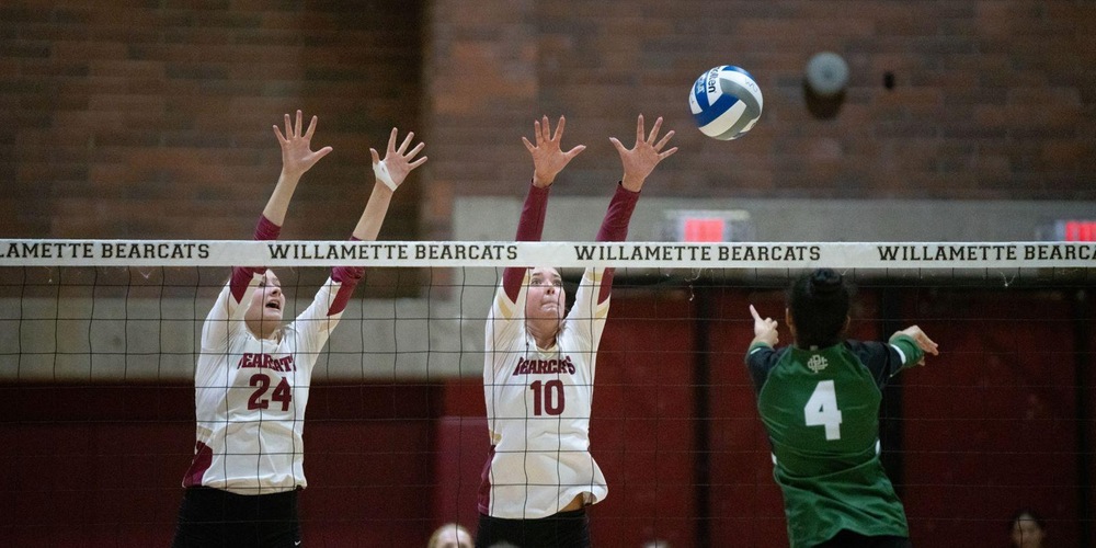 Two Willamette athletes attempt a block