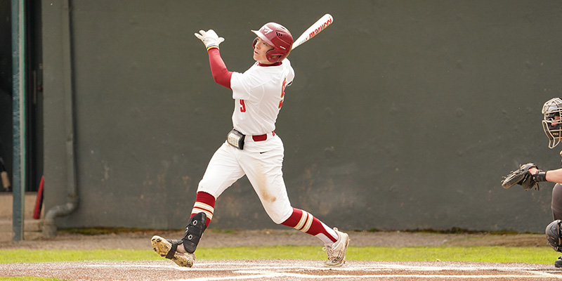 Lawson looks toward the outfield after hitting the ball for Willamette.