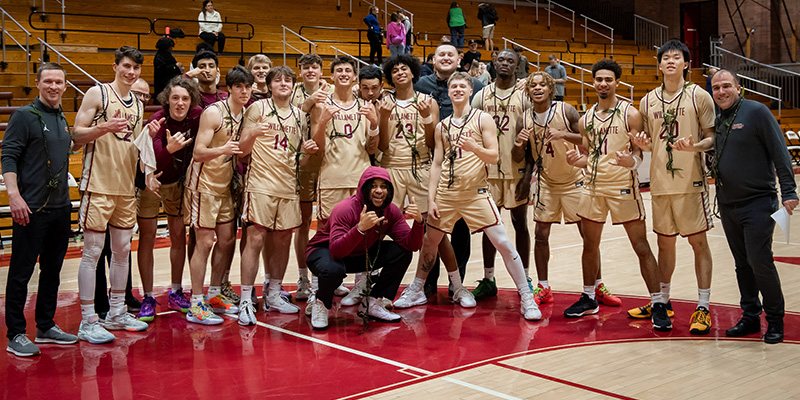 The 2023-24 Men's Basketball Team celebrates after a win.