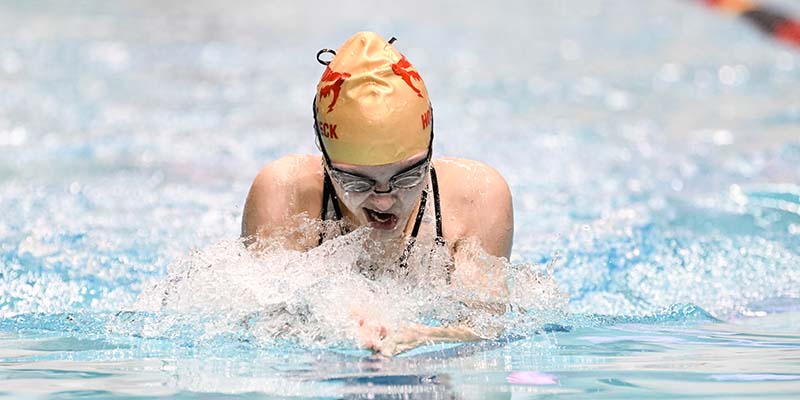 Anna Hornbeck swims the 100-yard breaststroke at the 2022 NWC Championshiops.