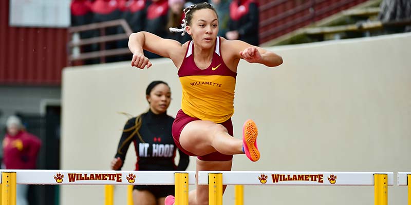 Katherine Thornton starts to leap over a hurdle.