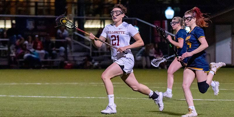Cedric Shaw goes on the attack for the Willamette University women's lacrosse team.