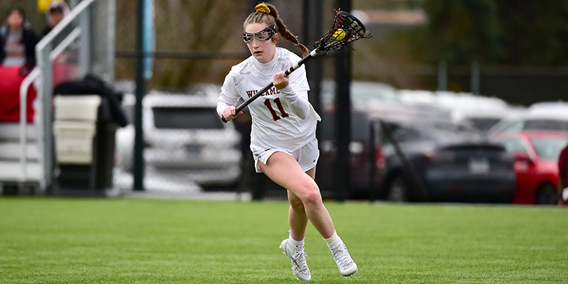 Shea Richardson-Pepper carries the ball up the field for the Bearcat women's lacrosse team. 
