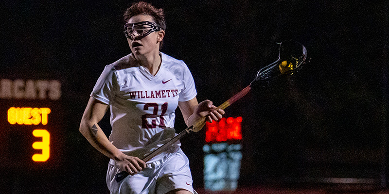 Cedric Shaw controls the ball for the Willamette women's lacrosse team.